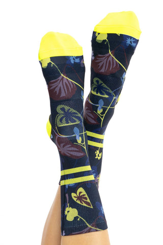 Top view of women’s cycling socks with Winter Floral print, yellow ankle stripes, and toes.
