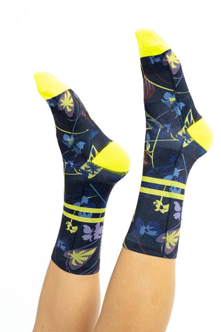 Side view of women’s cycling socks with Winter Floral print, yellow ankle stripes, and toes.